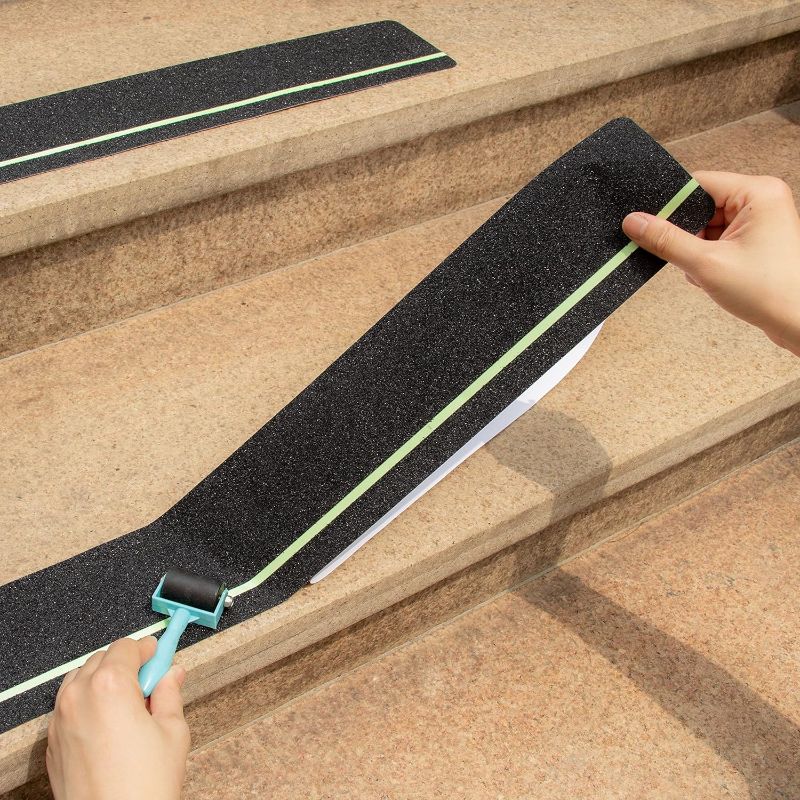 Photo 1 of 12-Pack 4”x30” Anti Slip Tape with Glow in the Dark Stripe, Pre-cut Stair Treads Non Slip Traction Tape with Roller for Outdoor/Indoor, Waterproof Non Skid Grip Tape for Stair Steps, Easy to Install
