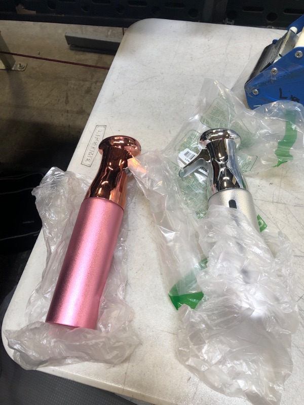 Photo 1 of 2 PC PINK AND SILVER SPRAY BOTTLES 