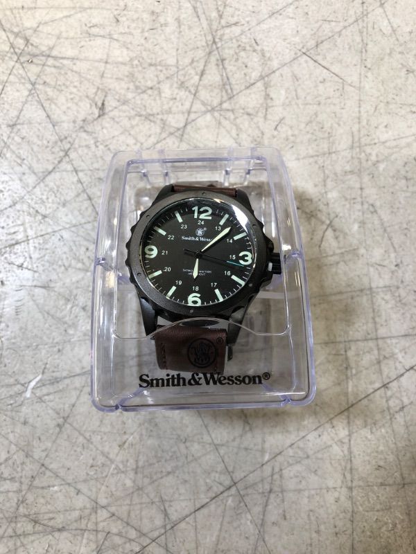 Photo 1 of Smith & Wesson Men's Classic Analog Watch
 (new, needs battery, protective peel on)