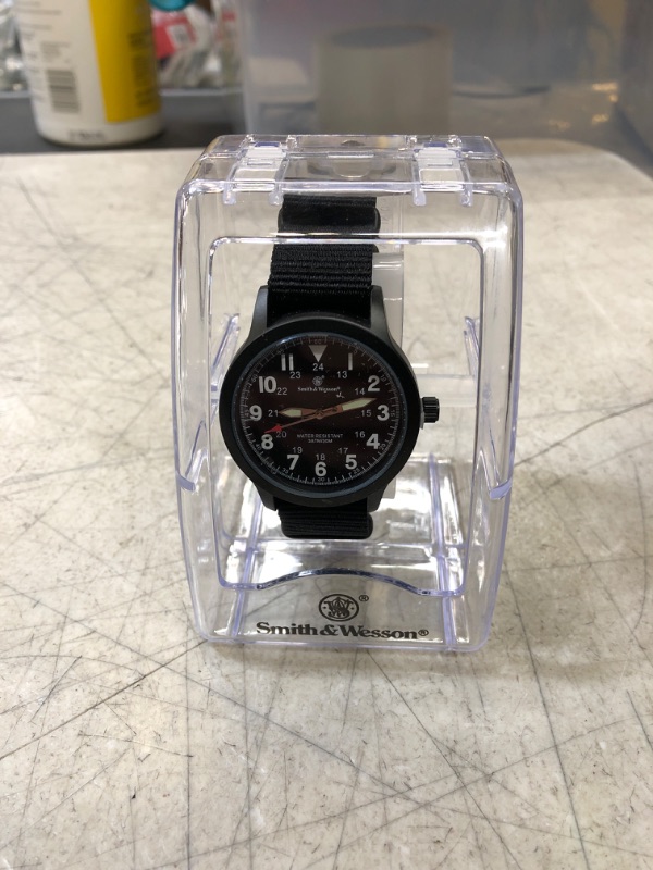Photo 2 of Smith & Wesson NATO field Watch
 (new, needs battery, protective peel on)
