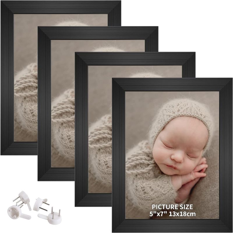 Photo 1 of ACHAVINM 5x7 Picture Frame Set of 4, Display Pictures 5 by 7, Wall or Tabletop Photo Frames (5 x 7, Black)
