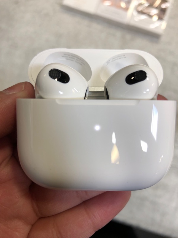 Photo 2 of Apple AirPods (3rd Generation) Wireless Ear Buds, Bluetooth Headphones, Personalized Spatial Audio, Sweat and Water Resistant, Lightning Charging Case Included, Up to 30 Hours of Battery Life
