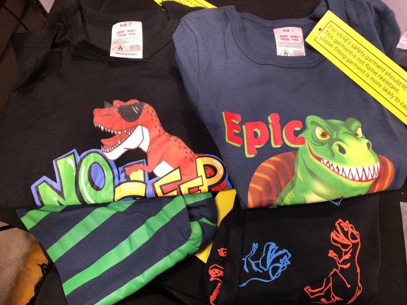 Photo 1 of 2 SETS OF DINOSAURE CLOTHES FOR KIDS SIZE 7