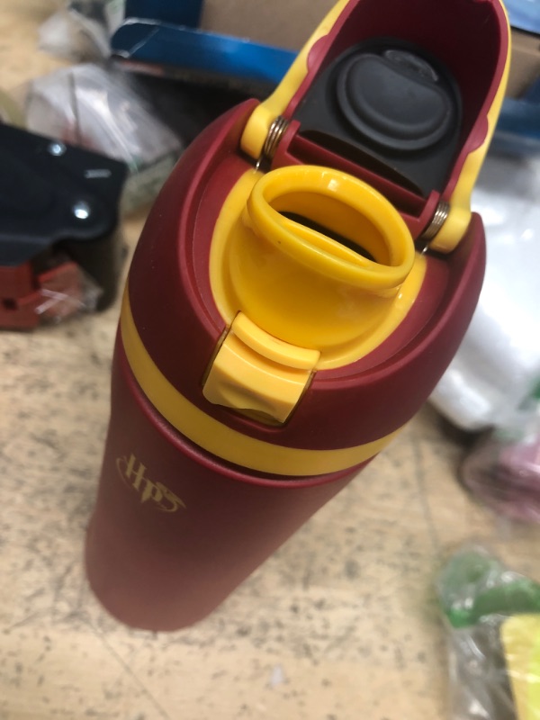 Photo 2 of **BUTTON THAT RELEASES CAP IS BROKEN, SEE PHOTO**
Owala Harry Potter FreeSip Insulated Stainless Steel Water Bottle with Straw, BPA-Free Sports Water Bottle, Great for Travel, 24 Oz, Gryffindor

