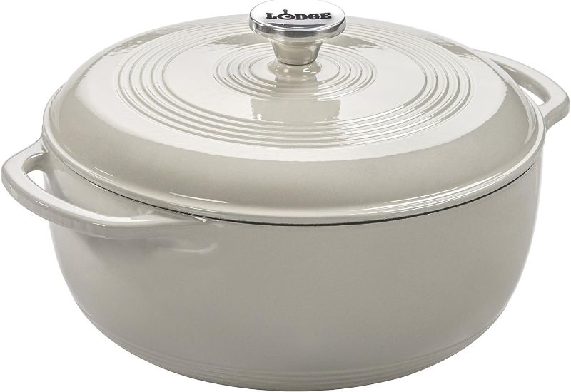 Photo 1 of **HANDLE IS CHIPPED***
Lodge 6 Quart Enameled Cast Iron Dutch Oven with Lid – Dual Handles – Oven Safe up to 500° F or on Stovetop - Use to Marinate, Cook, Bake, Refrigerate and Serve – Oyster White
