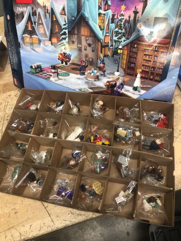 Photo 2 of LEGO Harry Potter 2023 Advent Calendar 76418 Christmas Countdown Playset with Daily Suprises, Discover New Experiences with this Holiday Gift Featuring 18 Hogsmeade Village Mini Builds & 6 Minifigures