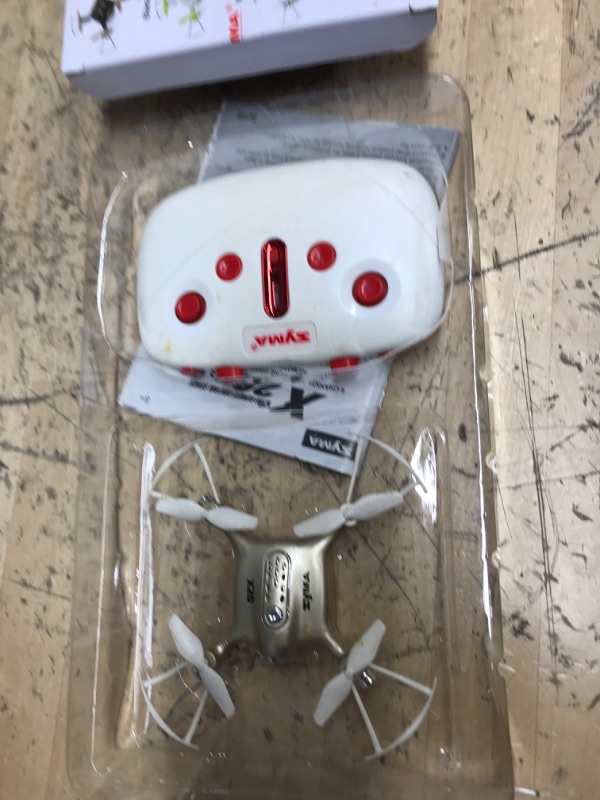 Photo 2 of **POWERS ON , MISSING CHARGING CORD**
DoDoeleph Newest Syma X20 Mini Pocket Drone Headless Mode 2.4Ghz Nano LED RC Quadcopter Altitude Hold Gold