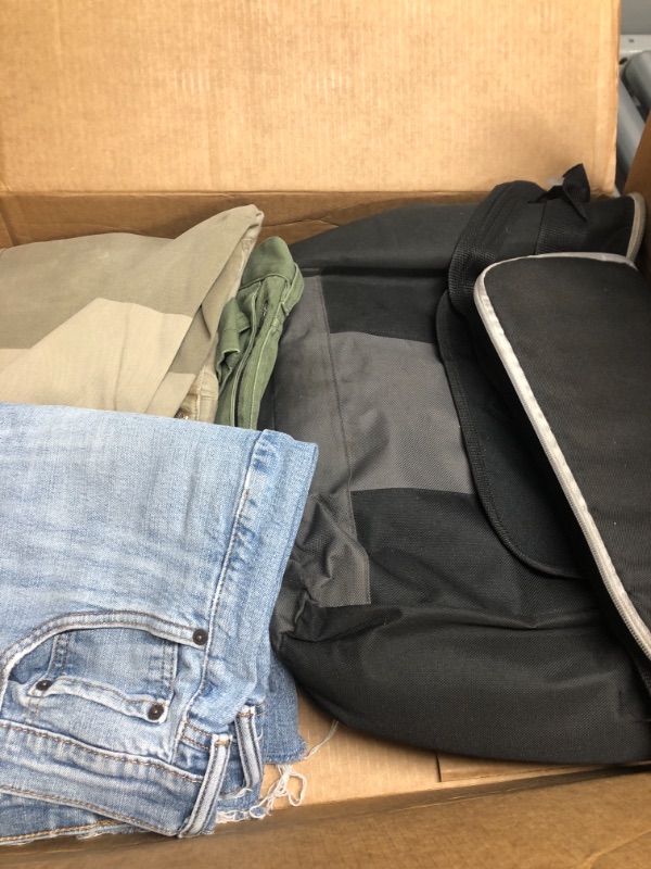 Photo 1 of Black bag, blue jean, green jeans, and brown pants.