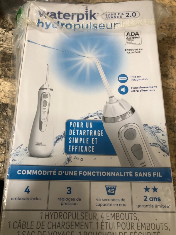 Photo 2 of Waterpik Cordless Advanced Water Flosser For Teeth, Gums, Braces, Dental Care With Travel Bag and 4 Tips, ADA Accepted, Rechargeable, Portable, and Waterproof, White WP-580 White Water Flosser