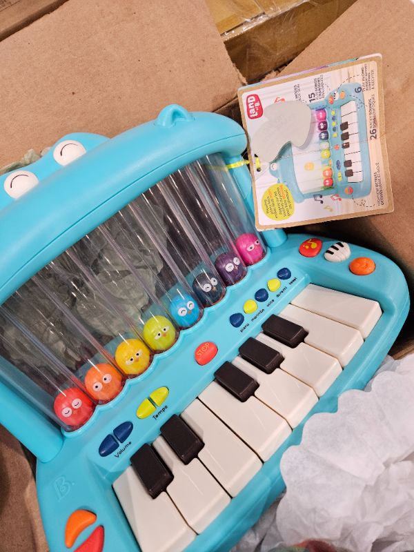 Photo 1 of B. toys- Hippo Pop- Musical Toy Keyboard – Play Piano – Songs, Sounds & Lights – Musical Instrument for Toddlers, Kids – 12 Months +
