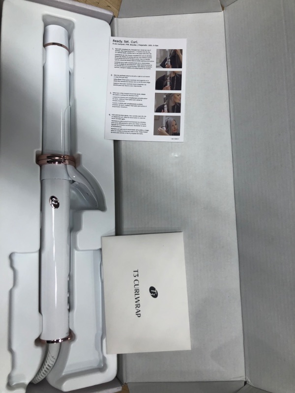 Photo 2 of **POWERS ON, HEATS FAST, AND SPINS**
T3 CurlWrap 1.25" Automatic Rotating Curling Iron with Long Barrel, 2 Timer Settings, 9 Heat Settings, Auto-Rotating Ceramic Barrel and Ion Generator for Fast, Easy Curls and Waves on All Hair Types