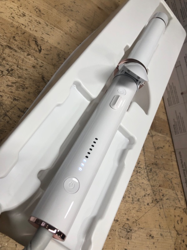 Photo 3 of **POWERS ON, HEATS FAST, AND SPINS**
T3 CurlWrap 1.25" Automatic Rotating Curling Iron with Long Barrel, 2 Timer Settings, 9 Heat Settings, Auto-Rotating Ceramic Barrel and Ion Generator for Fast, Easy Curls and Waves on All Hair Types