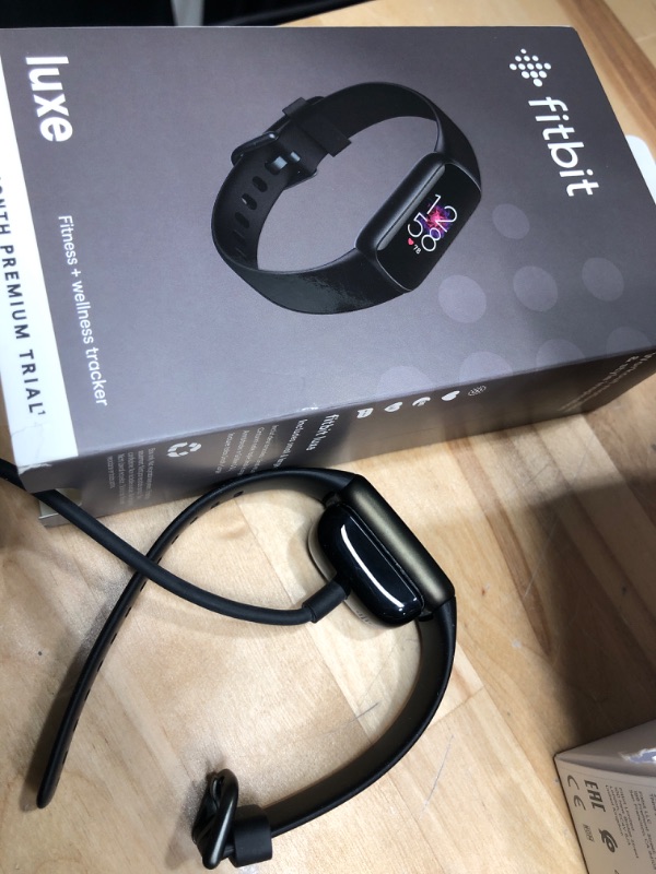 Photo 1 of Fitbit Luxe Fitness and Wellness Tracker with Stress Management, Sleep Tracking and 24/7 Heart Rate, Black/Graphite, One Size (S & L Bands Included)