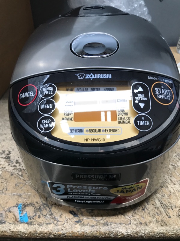 Photo 4 of **DENT IN FRONT**
Zojirushi NP-NWC10XB Pressure Induction Heating Rice Cooker & Warmer, 5.5 Cup, Stainless Black, Made in Japan