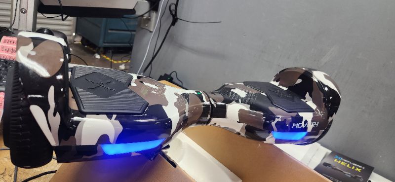 Photo 2 of (major damage )Hover-1 Helix Electric Hoverboard | 7MPH Top Speed, 4 Mile Range, 6HR Full-Charge, Built-in Bluetooth Speaker, Rider Modes: Beginner to Expert Hoverboard Camo