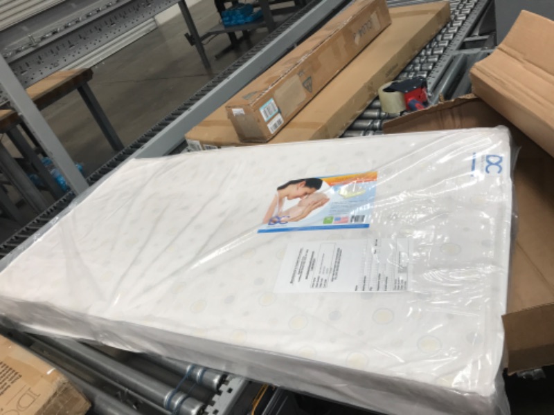 Photo 2 of Delta Children Twinkle Galaxy Dual Sided Crib and Toddler Mattress - Premium Sustainably Sourced Fiber Core - Waterproof - GREENGUARD Gold Certified (Non-Toxic) - 7 Year Warranty - Made in USA