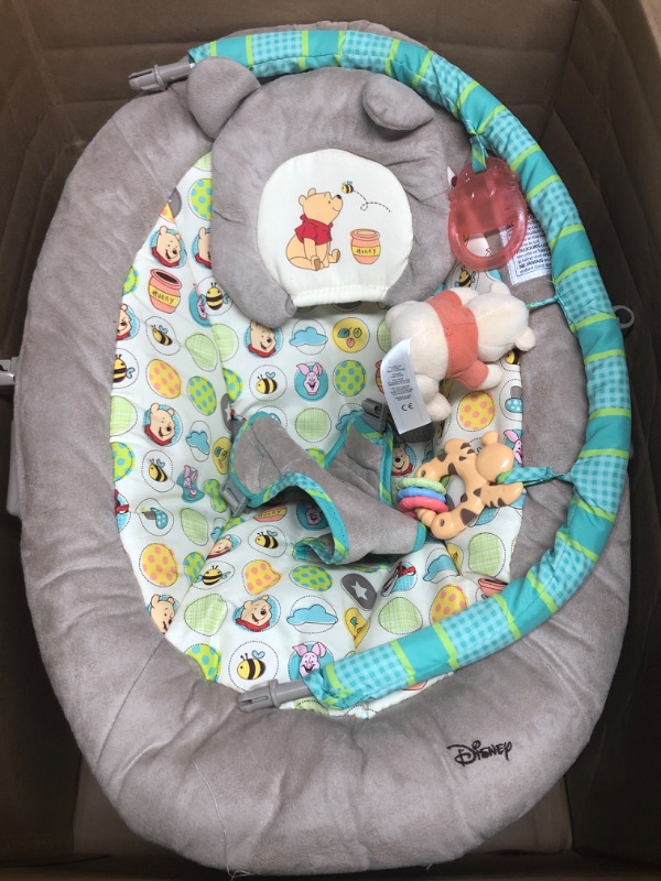 Photo 2 of Bright Starts Winnie the Pooh Dots & Hunny Pots Baby Bouncer with Vibrating Infant Seat, Music & 3 Playtime Toys, 23x19x23 Inch