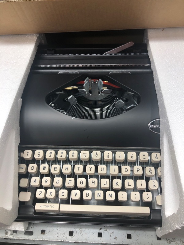 Photo 2 of **DAMAGED, CANNOT HOLD PAPER IN PLACE, SOME KEYS NON-FUCNTIONAL** Black Manual Typewriter Portable Model 