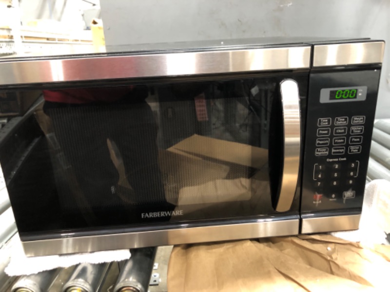 Photo 2 of ***TESTED/ POWERS ON***TOSHIBA EM131A5C-SS Countertop Microwave Oven, 1.2 Cu Ft with 12.4" Turntable, Smart Humidity Sensor with 12 Auto Menus, Mute Function & ECO Mode, Easy Clean Interior, Stainless Steel & 1100W Silver Microwave Oven