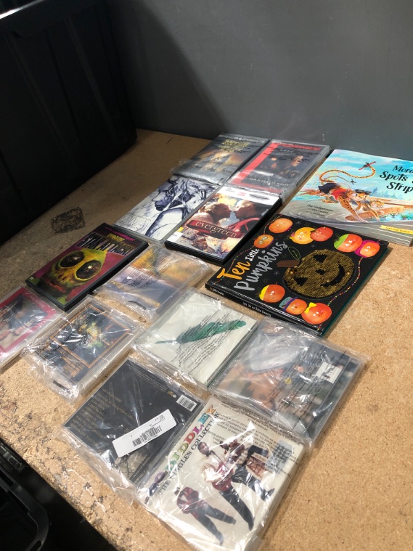 Photo 1 of 14 ITEMS*
CD AND DVD BUNDLE