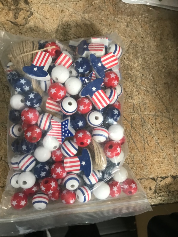 Photo 2 of 150 Pieces Independence Day Wood Beads 4th of July Wooden Beads America Blue White Red Stars Round Wood Beads Patriotic Wood Beads with Twine for Home DIY Tiered Tray Garland Decors (Cute Style)