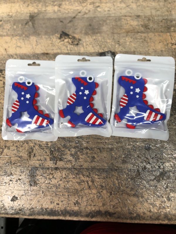 Photo 1 of 3 PACK OF 4th of July Silicone Baby Teething Toys for Babies 6-12 Months, Red White & Blue Dinosaur Baby Teether Toy Teething Pain Relief Baby Chew Toy 3 Months, Infant Toys for Boys Girls 4th of July Gifts
