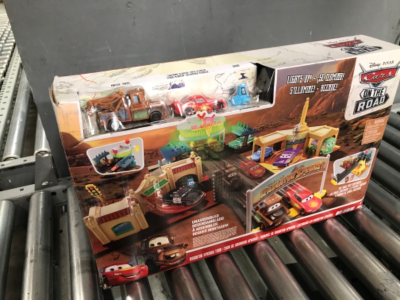 Photo 2 of Disney And Pixar Cars On The Road Radiator Springs Tour Playset With 2 Vehicles And Light-Up Countdown, Features Lightning McQueen Racer, Mater Truck And Guido Vehicles, Toy Gift For Kids