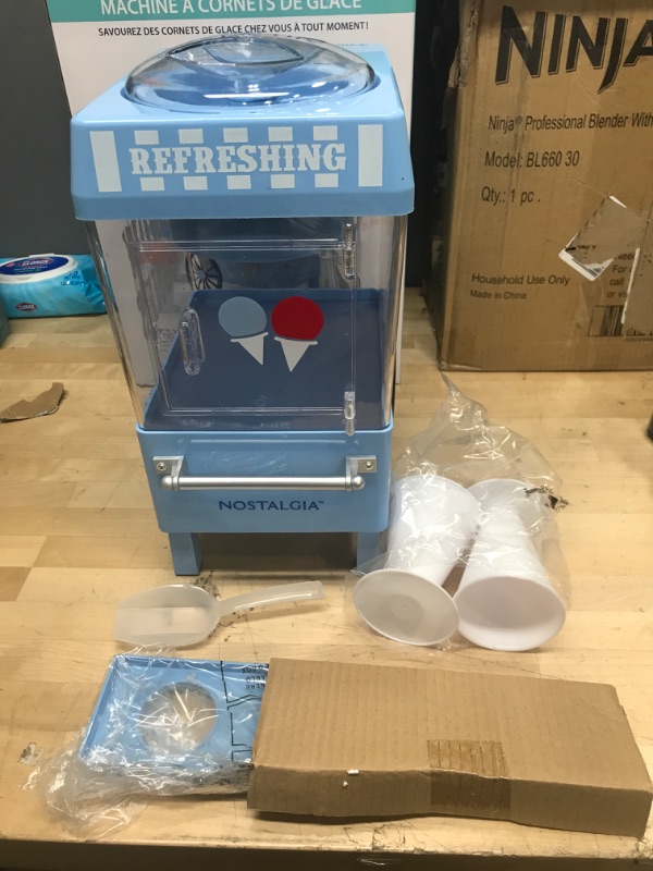 Photo 2 of ***POWERS ON*** Nostalgia Snow Cone Shaved Ice Machine - Retro Table-Top Slushie Machine Makes 20 Icy Treats - Includes 2 Reusable Plastic Cups & Ice Scoop - Blue