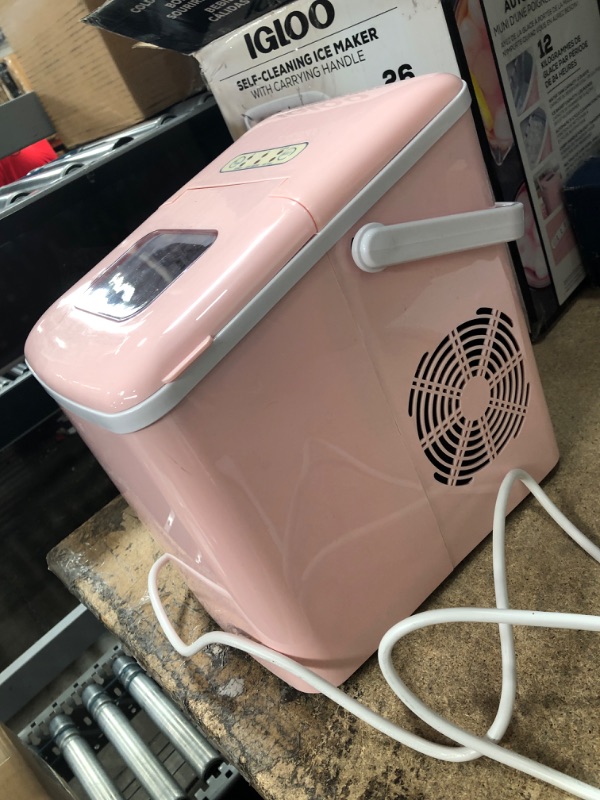 Photo 3 of **USED**
Igloo 26-Pound Automatic Self-Cleaning Portable Countertop Ice Maker Machine with Handle, Pink Pink Ice Maker
**MISSING SCOOP**