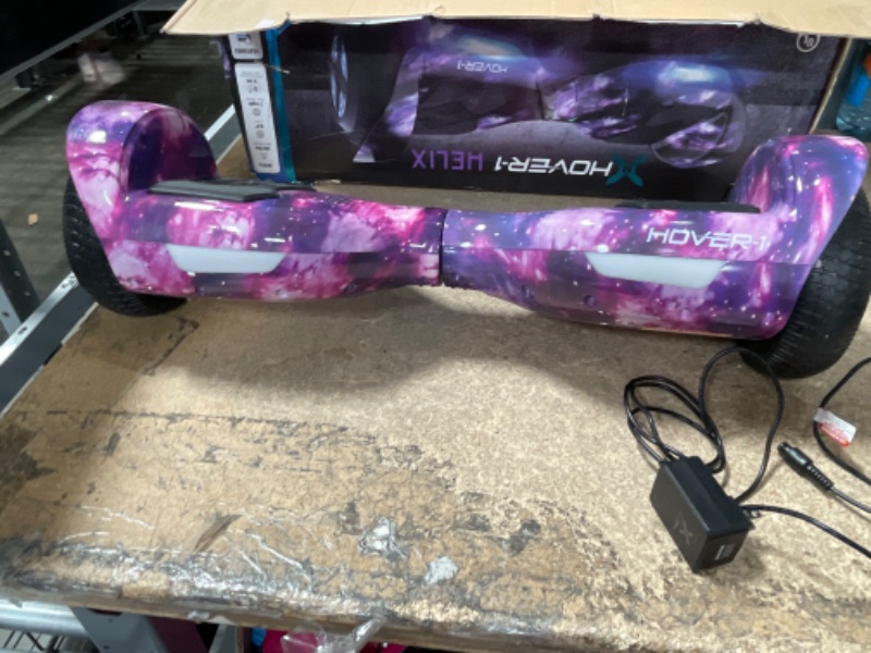 Photo 2 of **USED**
Hover-1 Helix Electric Hoverboard | 7MPH Top Speed, 4 Mile Range, 6HR Full-Charge, Built-in Bluetooth Speaker, Rider Modes: Beginner to Expert Hoverboard Galaxy