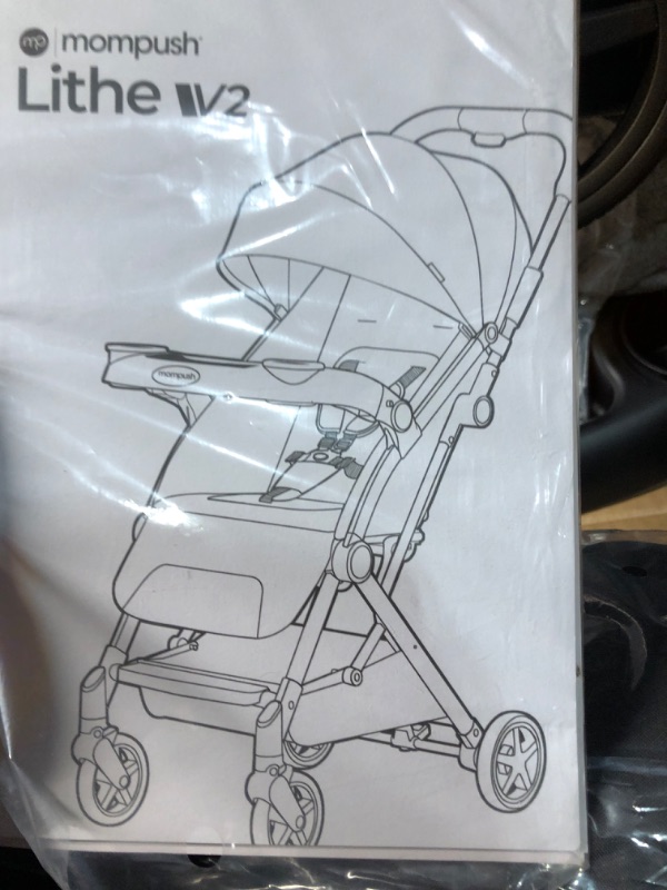 Photo 1 of Mompush Lithe V2 Lightweight Stroller + Snack Tray, Ultra-Compact Fold & Airplane Ready Travel Stroller, Near Flat Recline Seat, Cup Holder, Raincover & Travelbag Included Grey