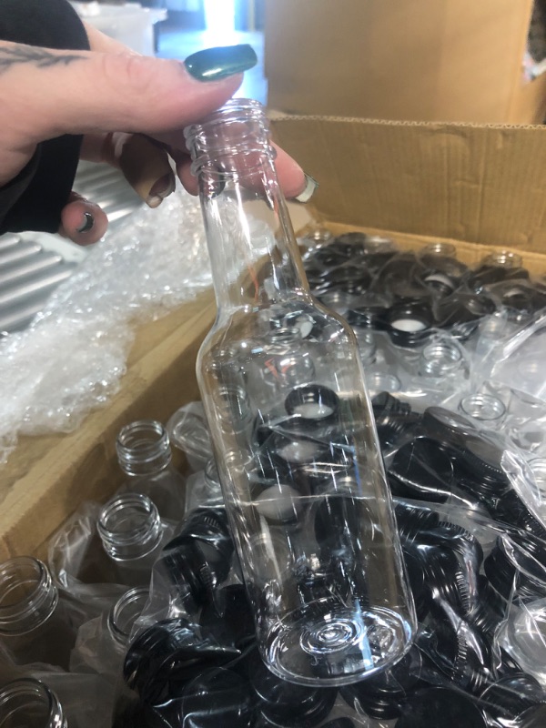 Photo 2 of 100 Pcs Hot Sauce Bottles Small Plastic Bottles Clear Woozy Bottles Empty with Leak Proof Black Screw Cap Mini Wine Liquor Bottles for Kitchen Sauce Salad Dressing Syrup Juice Whiskey Party (5 oz)