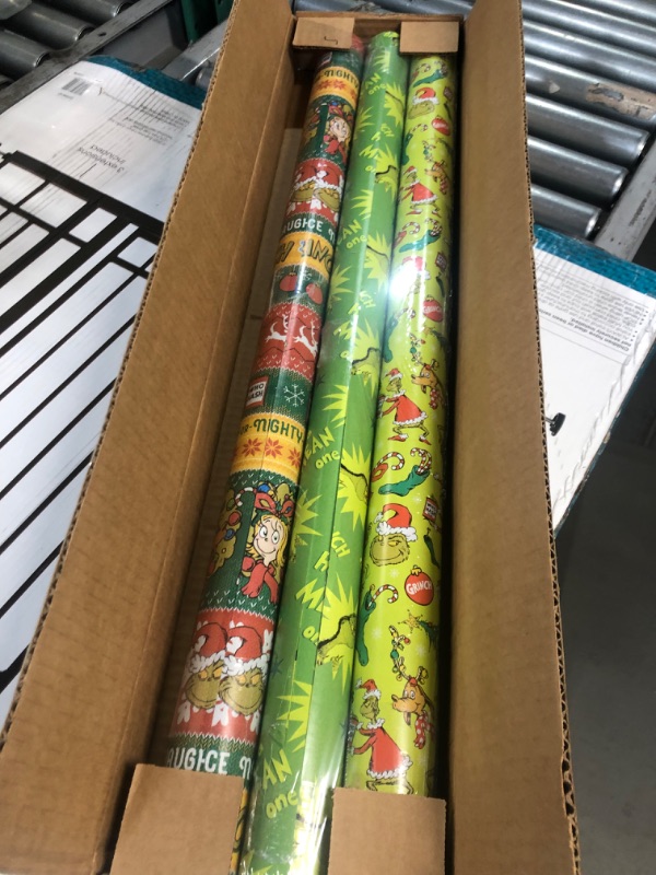 Photo 2 of American Greetings Christmas Wrapping Paper with Cut Lines Bundle, The Grinch (3 Rolls, 105 sq. ft.)