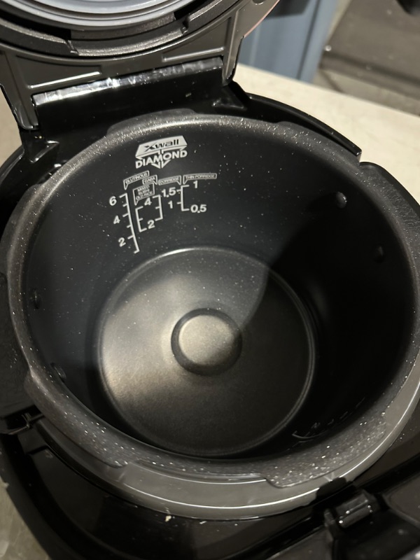 Photo 6 of **USED/DIRTY**
CUCKOO CRP-P0609S | 6-Cup (Uncooked) Pressure Rice Cooker- Black/Copper