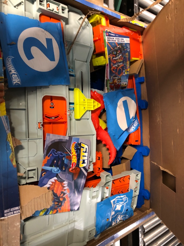 Photo 2 of Hot Wheels City Ultimate Garage Playset with 2 Die-Cast Cars, Toy Storage for 50+ 1:64 Scale Cars, 4 Levels of Track Play, Defeat The Dragon