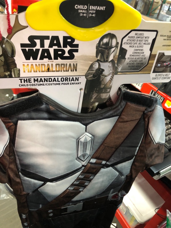 Photo 1 of STAR WARS The Mandalorian Official Youth Deluxe Costume - Padded Jumpsuit with Gloves, Detachable Cape, and Plastic Mask Medium