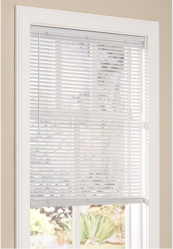 Photo 1 of ***USED - MISSING HARDWARE***
Vinyl Mini Blinds 1-inch Cordless Room Darkening Blind for Windows 47" W x 64" H
