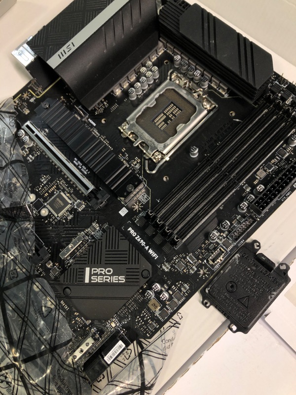 Photo 2 of MSI PRO Z790-A WiFi ProSeries Motherboard (Supports 12th/13th Gen Intel Processors, LGA 1700, DDR5, PCIe 5.0, M.2, 2.5Gbps LAN, USB 3.2 Gen2, Wi-Fi 6E, ATX) ATX PRO Z790-A WIFI
Opened for pictures