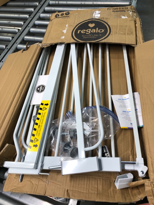 Photo 1 of Regalo Easy Step 49-Inch Extra Wide Baby Gate, Includes 4-Inch and 12-Inch Extension Kit, Pressure Mount Kit and 4 Pack of Wall Mount Kit, 4 Count (Pack of 1) White
