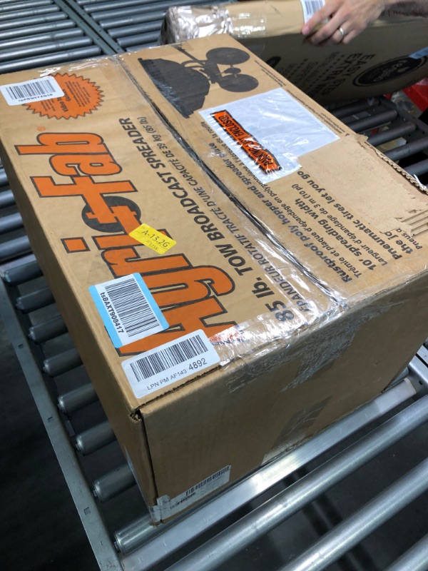 Photo 1 of Agri-Fab Inc 45-0530-131, 85 lb. Tow Broadcast Spreader, Black/Orange