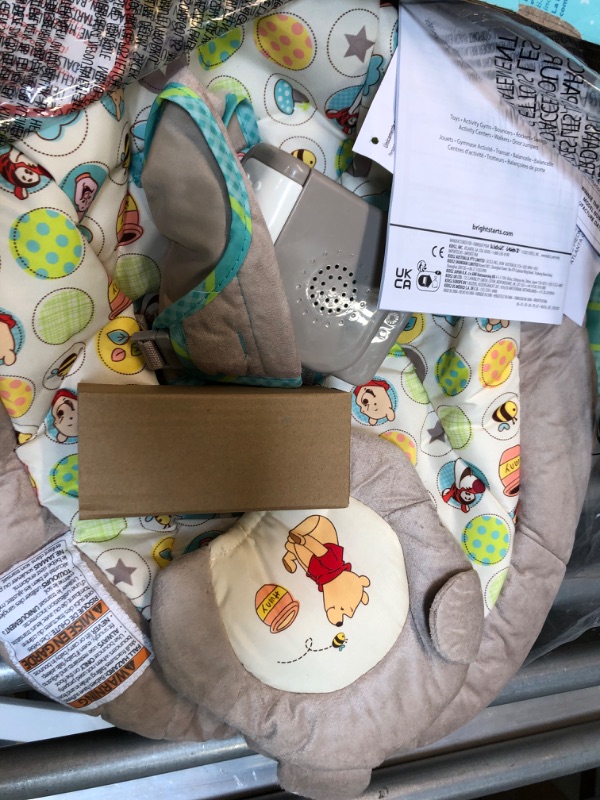 Photo 1 of Bright Starts Winnie the Pooh Dots & Hunny Pots Baby Bouncer with Vibrating Infant Seat, Music & 3 Playtime Toys, 23x19x23 Inch
