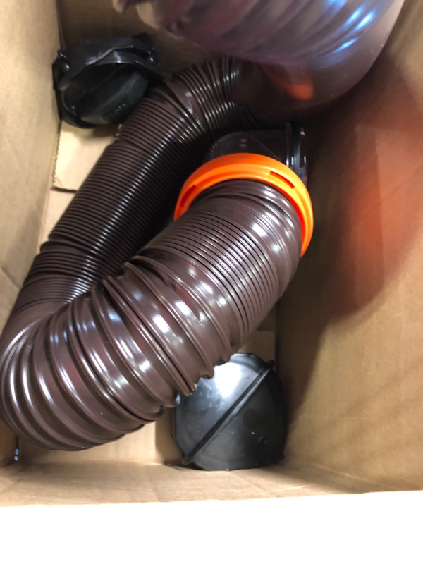 Photo 3 of Camco 20' (39742) RhinoFLEX 20-Foot RV Sewer Hose Kit, Swivel Transparent Elbow with 4-in-1 Dump Station Fitting-Storage Caps Included , Black , Brown 20ft Sewer Hose Kit Frustration-Free Packaging