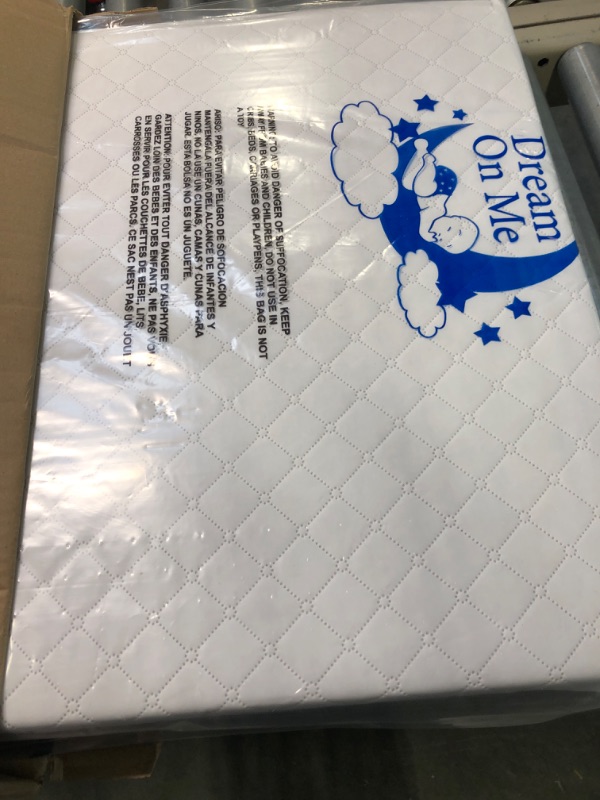 Photo 2 of Dream On Me Two Sided Contour Changing Pad 2022, White, Lightweight with Non Skid Bottom, Convenient Safety Strap, Waterproof Vinyl Cover, Phthalate Snow White