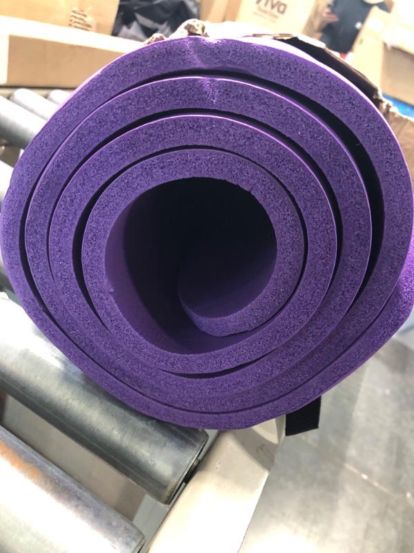 Photo 1 of Amazon Basics Extra Thick Exercise Yoga Gym Floor Mat with Carrying Strap - 74 x 24 x .5 Inches, Purple & High-Density Round Foam Roller for Exercise and Recovery - 36 Inch, Black