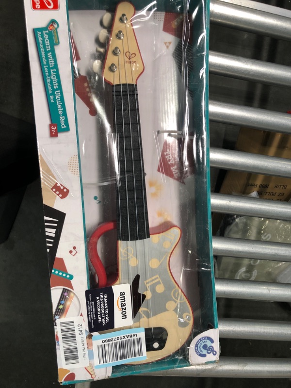 Photo 2 of Hape Learn with Lights Electronic Ukulele Red | Leaning and Band Mode | Musical Instrument