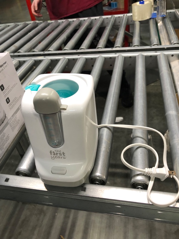 Photo 1 of The First Years 2-in-1 Simple Serve Bottle Warmer | Quickly Warm Bottles of Breastmilk or Formula | Sanitize Pacifiers | Compact Design | Holds Wide Narrow and Angled Bottles 2 in 1 Bottle Warmer