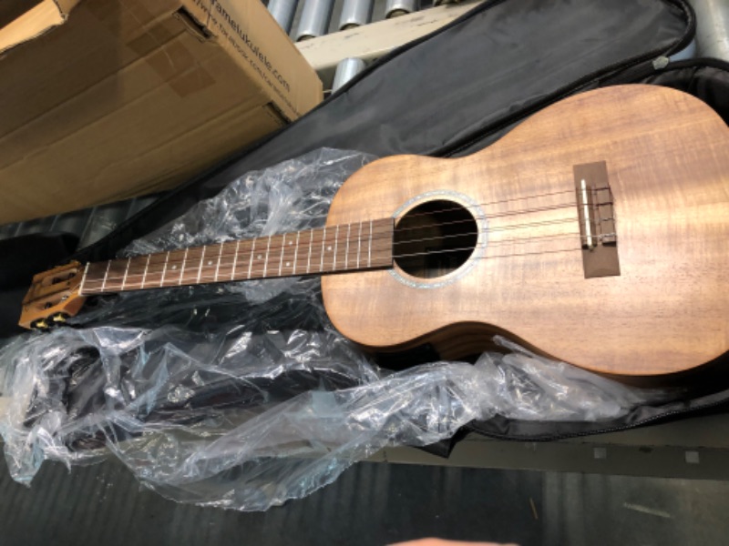 Photo 2 of Caramel CB207 Acacia Baritone Acoustic Electric Ukulele with Truss Rod with Additional Strings, Padded Gig Bag, Strap and EQ cable Laminated