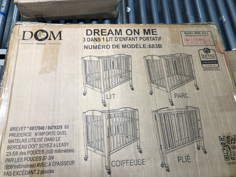 Photo 1 of Dream On Me 3-in-1 Folding Portable Crib, White, Large White Crib