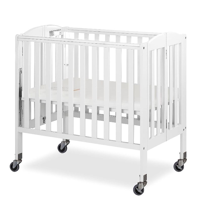 Photo 1 of Dream On Me 3-in-1 Folding Portable Crib, White, Large White Crib
