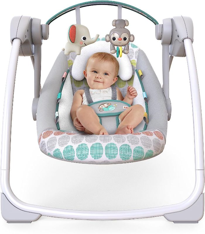 Photo 1 of Bright Starts Portable Automatic 6-Speed Baby Swing with Adaptable Speed, Taggies, Music, Removable -Toy Bar, 0-9 Months 6-20 lbs (Whimsical Wild)